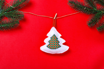 Christmas decoration tree hanging on rede background