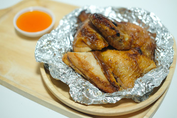 Roasted chicken food on aluminum foil