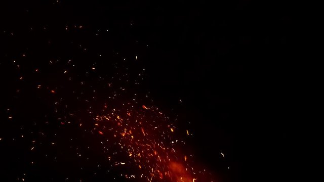 Bonfire camping at night with magical embers