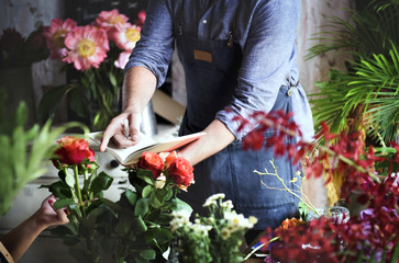 Flower shop business owner working service