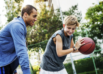 Naklejka premium Young basketball player shoot
