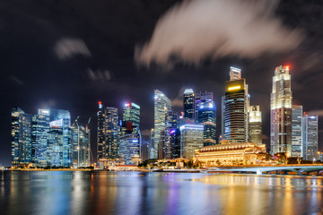 Fototapeta na wymiar Fantastic night view of skyscrapers by Marina Bay, Singapore
