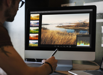 Man editing photos on a computer