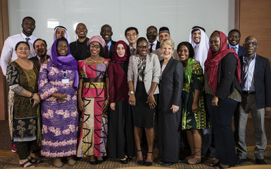 A Group of International Business People Poses for a Photoshoot
