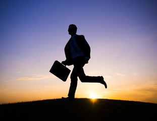 Businessman running in the rush hour