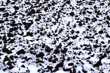 plowed land under the snow in winter