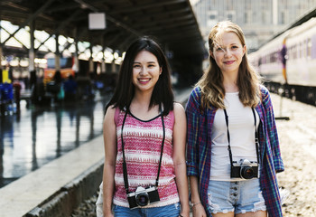 Young tourists at train station