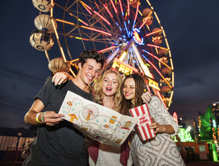 A group of friends is enjoying the amusement park