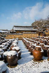 Beautiful landscape with traditional korean-style house and white snow on Jangdokdae.