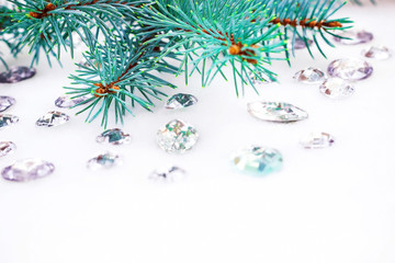 Blue spruce branch with crystals for decoration.