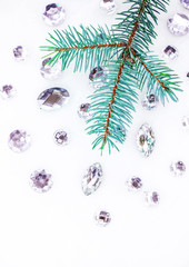 Fototapeta na wymiar Blue spruce branch with crystals for decoration.