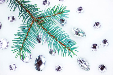 Blue spruce branch with crystals for decoration.