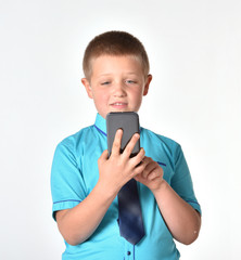 Young businessman. Business people. The boy is looking into the mobile phone. The isolated boy.