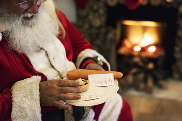 Santa Claus with snack - obrazy, fototapety, plakaty