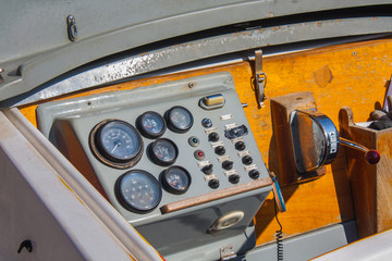 Helm of a boat, vintage wooden navigation panel