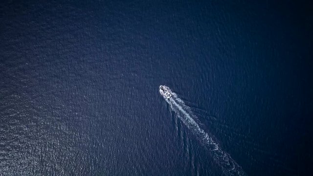 Aerial view of a motor boat sailing the sea fast
