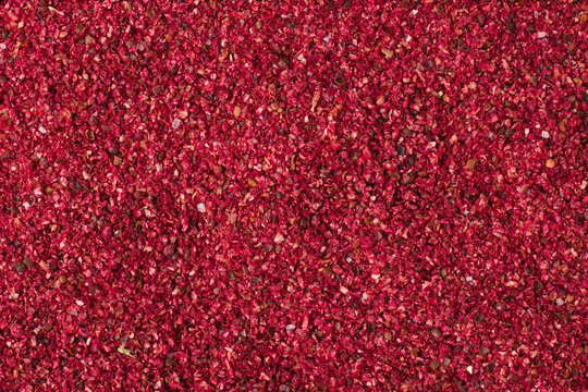 Dried sumac spice as a background, natural seasoning texture
