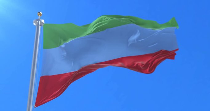 Flag of Dagestan waving at wind with blue sky in slow, loop