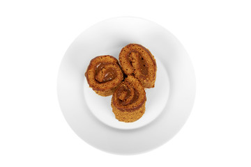 delicious chocolate with milk Swiss roll cake on plate isolated on white background, home made dessert