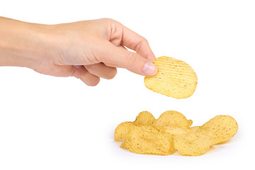tasty corrugated chips in hand isolated on white background, potato chips, unhealthy food, many fat...