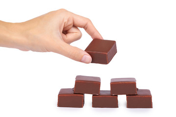 gourmet Chocolate bar in hand isolated on white background, home made sweets, unhealthy food