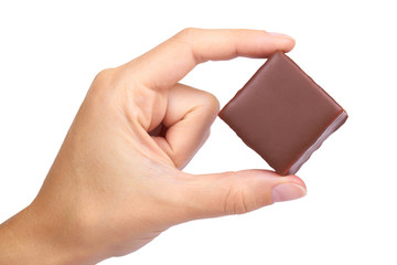 gourmet Chocolate bar in hand isolated on white background, home made sweets, unhealthy food