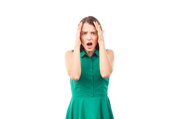 Portrait of emotional young woman in emerald green dress on white background