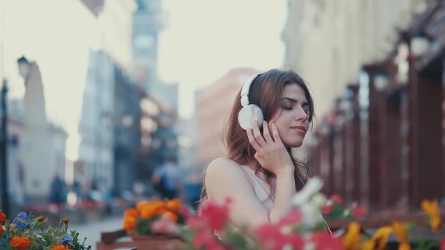 Young attractive girl listening to music
