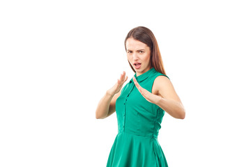 Fototapeta premium Portrait of emotional young woman in emerald green dress on white background
