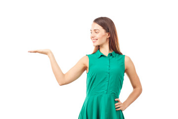 Portrait of emotional young woman in emerald green dress on white background