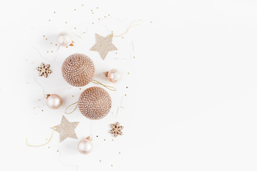 Christmas composition. Christmas balls, golden decorations on white background. Flat lay, top view, copy space