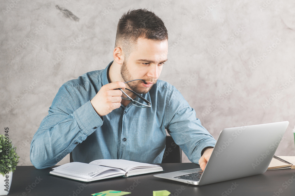 Poster attractive guy working on project