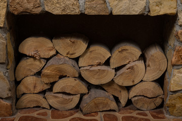 Chopped firewood stacked in a fireplace. Selective focus