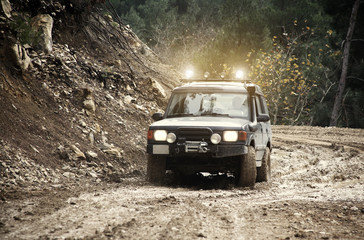 Obraz na płótnie Canvas Driving Off Road Car in the mud