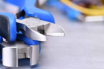 Electrician tools on table close-up with selective focus