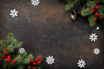 Christmas composition. Christmas tree and decorative ornaments on a dark stone and slate background. Flat lay, top view with copy space.