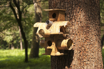 Feeder with a lodge for birds