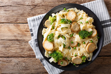 Homemade pasta with King Brown Mushroom, cheese and vegetables close-up. horizontal top view