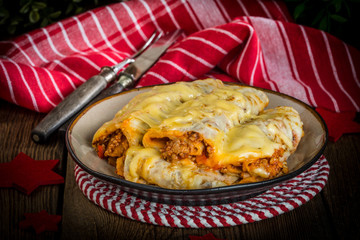 Italian lasagna rolls on a plate. Small depth of field.