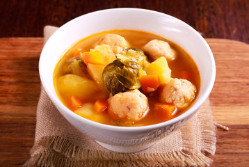 Soup with brussels sprouts, chicken balls and red lentil