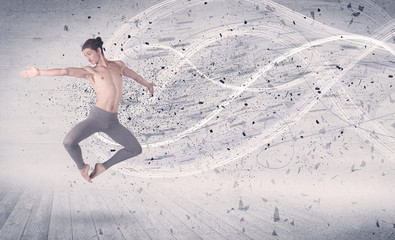 Performance ballet dancer jumping with energy explosion particles