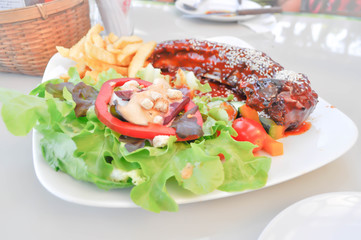 pork rib steak with salad
