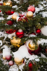 Toys on Christmas tree with snow