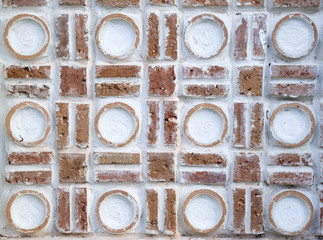 White wall with circle relief ornaments