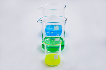 Glass beaker set stock images. Glass Measuring Beaker. Laboratory beaker on a white background. Beaker with colored liquid