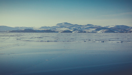 Fototapeta na wymiar Baikal Lake. Ice, rocks, winter Landscape in Siberia