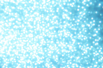 Abstract blue bokeh lights on background
