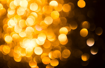 Gold glitter vintage lights texture background Christmas. defocused