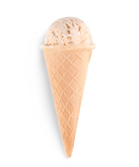 Waffle cone with caramel ice cream on white background