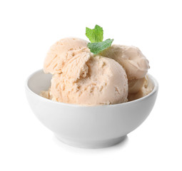 Bowl with caramel ice cream on white background